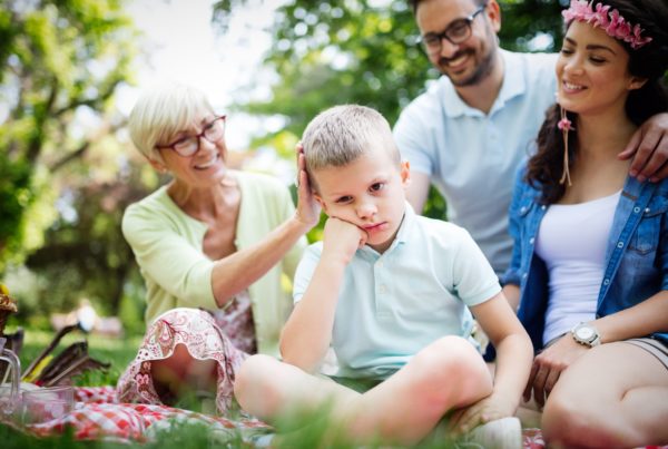 Family consoling little stubborn child and managing emotions